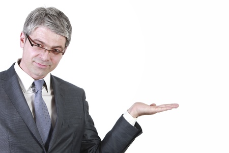 Businessman holding hand high to show something on a white board の写真素材