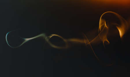 Abstract figures of smoke in darkの写真素材