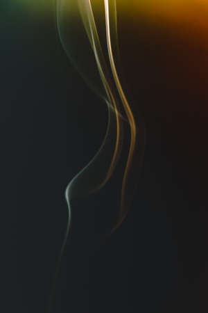 Abstract figures of smoke in darkの写真素材