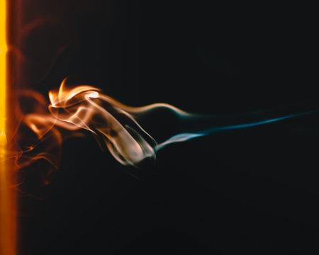 Abstract figures of smoke in darkの写真素材