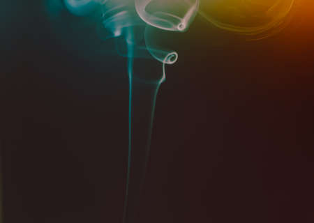 Abstract figures of smoke in darkの写真素材