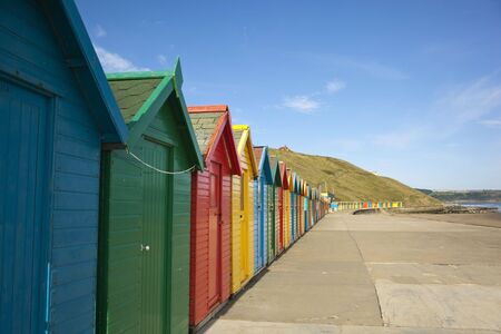 a row of colourful beach huts on the east coast of englandの写真素材