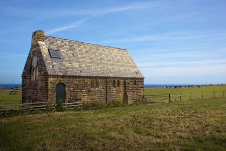 an old church in a rural coastal setting in summerの写真素材