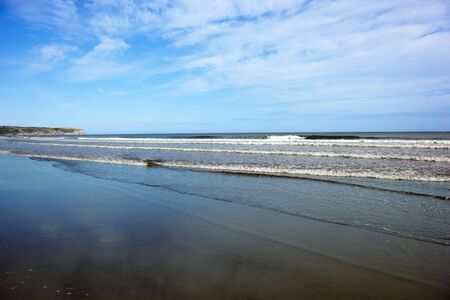 sand sea and sky on the east coast of englandの写真素材