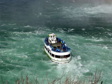 Tourist boat at Niagara Falls in spring, Canada          の写真素材