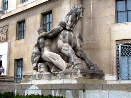 Man Controlling Trade Sculpture near Federal Trade Commission in Washington DC, USA                                  の写真素材