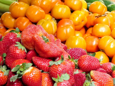  Red strawberry and persimmon on bazaar Carmel in Tel Aviv, Israel                                 の写真素材