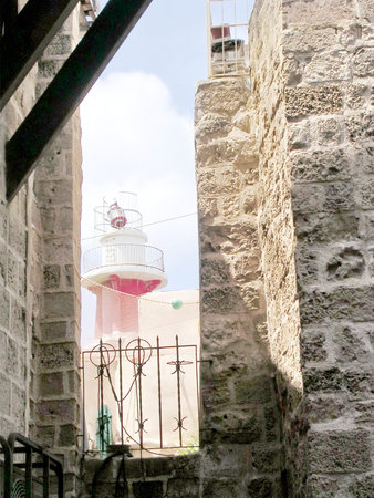 View to lighthouse from Netiv HaMazolot street in old city Jaffa, Israelの写真素材