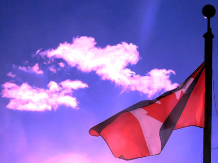 Canadian flag waving in the blue sky above the city Thornhill, Canada, June 21, 2017の写真素材