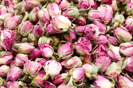 Dry rose buds, healthy herbal tea background.の写真素材