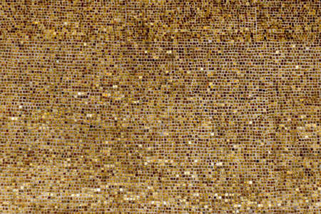 Wall of small gold platesの写真素材