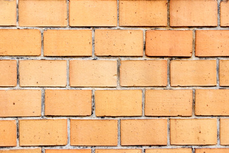 Wall of orange bricks  closeup
