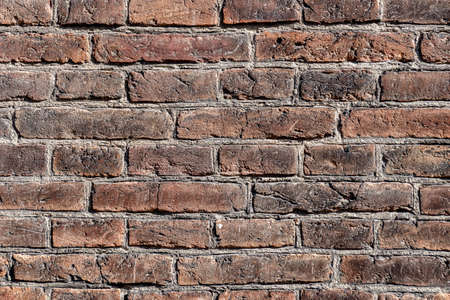Wall of brown burned brick handmadeの写真素材