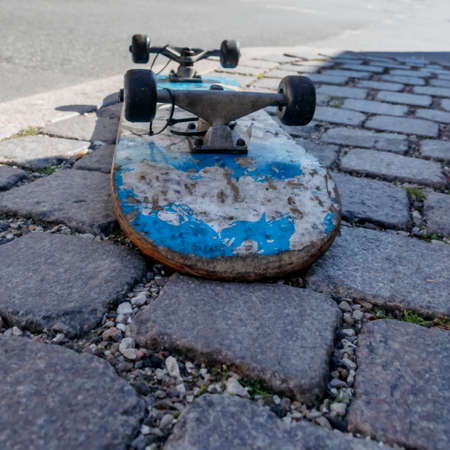 The old dirty scratched skateboardの写真素材