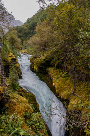 Mountain river between mossy stonesの写真素材