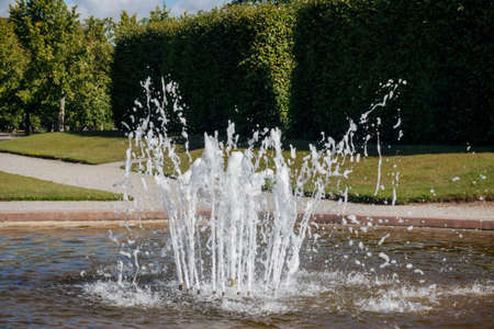 A small fountain in the city park wallpaperの写真素材