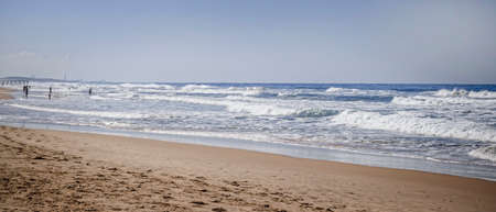 City beach in autumn, sand, foamy wavesの写真素材