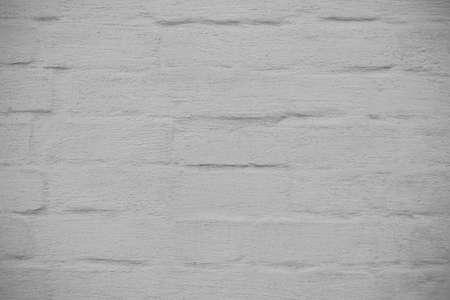 Textured surface of a white brick wallの写真素材