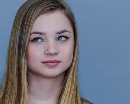 Face of a blonde adolescent girl close-up portrait
