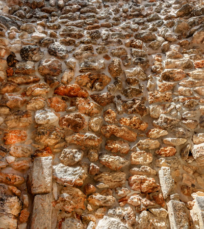 Wall of untreated stone of the ancient city of Maya