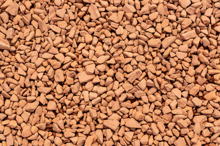 The surface of the brick pieces of various shapes of ocher color