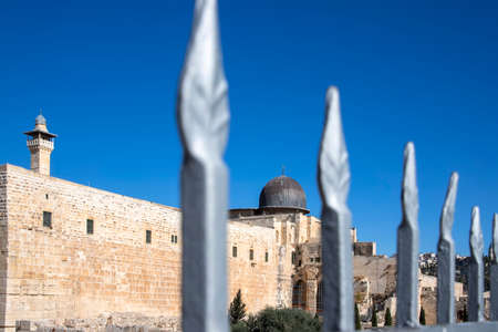 View of the dome of the Al Aqsa Mosque in Jerusalem through a metal fence. Israelの写真素材