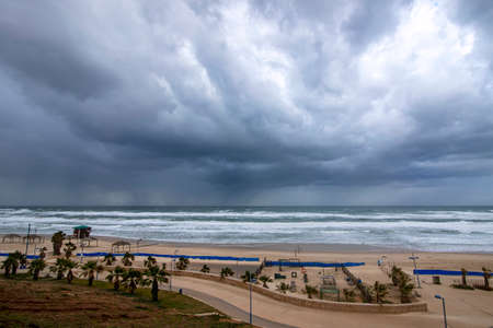 View of the city beach, sea and sky in clouds during a storm. Israelの写真素材