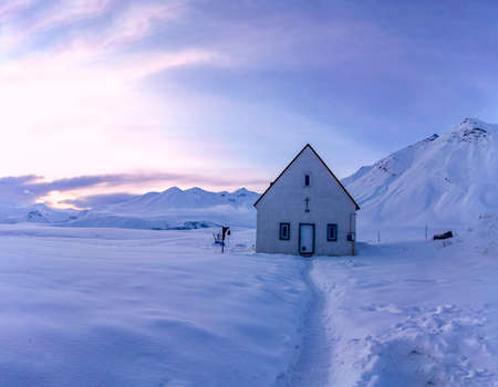 Church on the snowy Cross Pass on the Georgian Military Highway during sunset. Georgiaの写真素材