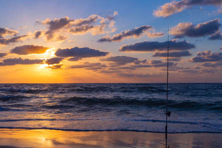 Sunset on the Mediterranean Sea. Dramatic sky in the clouds. The reflection of the sun on the waves. Israelの写真素材