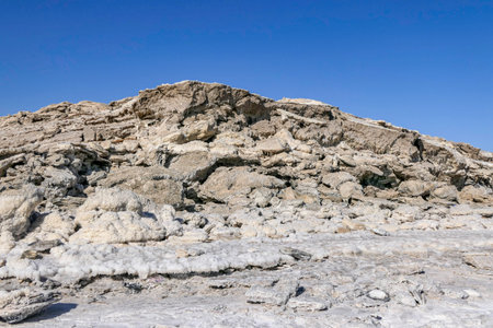 Ecological catastrophe of the disappearing Dead Sea. Erosion and salt formations on the surface of the earth.の写真素材