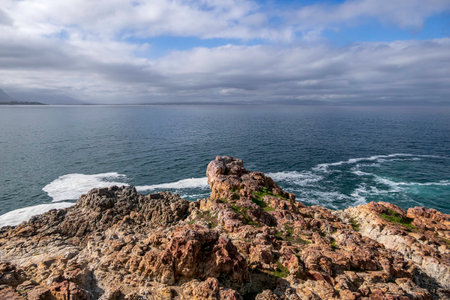View of the sea through the coastal cliffs at low tide.の写真素材