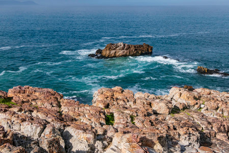 View of the sea through the coastal cliffs at low tide.の写真素材