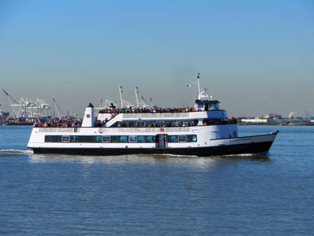 Tourists aboard the Statue of Liberty Ferryのeditorial素材