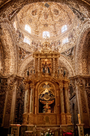 Incredible baroque style rosary chapel adorned with gold and religious figures located in Puebla Mexico.のeditorial素材