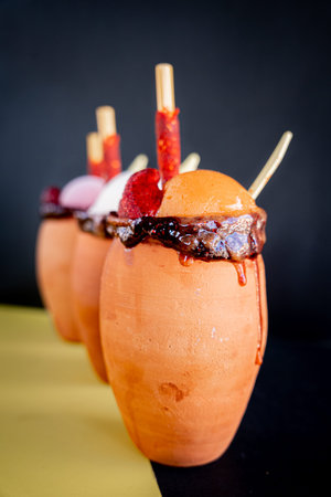 Exquisite cantaritos with tequila and mango, strawberry and lime snow, accompanied by Mexican...
