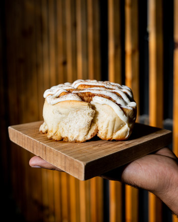 Delicious and fluffy cinnamon glazed and tasty cinnamon rollの写真素材