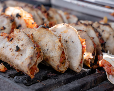 Mexican-style marlin tacos prepared with avocado, onion, and coriander with a glass of wine