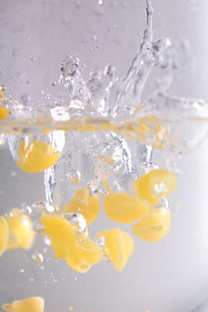 Pastas falling in the waterの写真素材