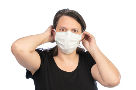 Woman with a protective mask on a white background