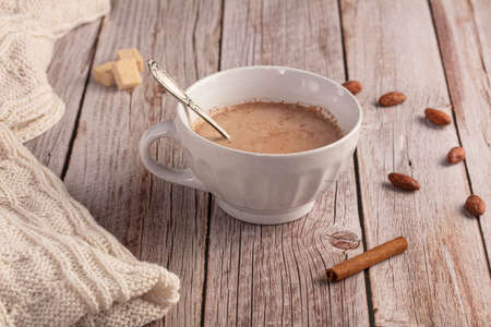 Bowl of hot chocolate in the morning on a wooden tableの写真素材