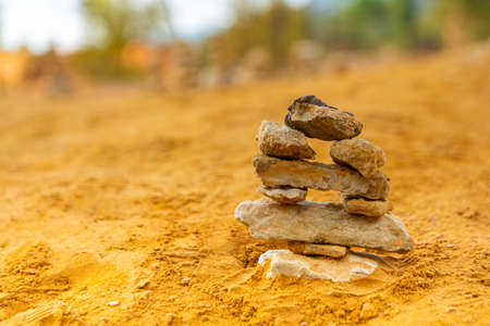 Pile of stones in balance land art in natureの写真素材