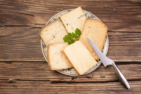 Raclette cheese platter on a wooden table
