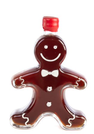 Bottle in the shape of a man with gingerbread syrup on a white background