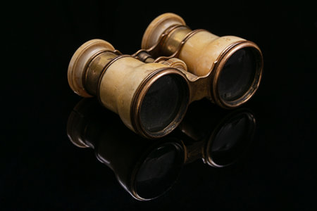 Antique theater binoculars in ivory on a black backgroundの写真素材