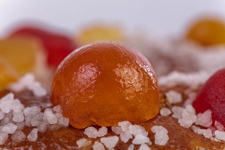 Detail of a candied fruit on a kings' bun for the Epiphany