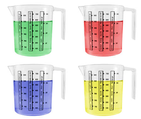 Four Measuring Jugs Full of Coloured Liquidsの写真素材