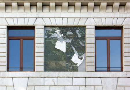 Close-up of the exterior of the Palazzo del Podesta in Padua, Italy, showing a map of the 1930s Italian Empireの写真素材