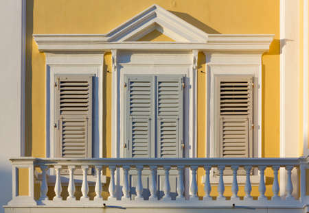 Closeup on a balcony of a neoclassic buildingの写真素材