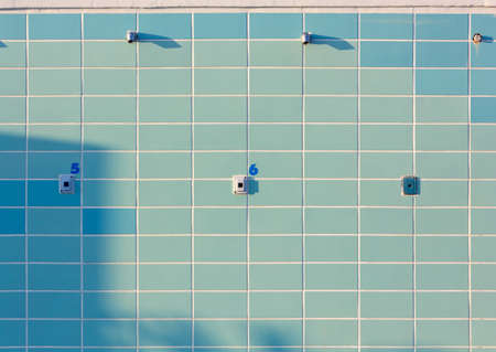 Blue tiled numbered outdoor beach showersの写真素材