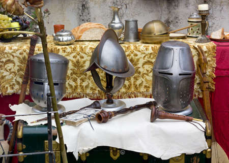 Medieval helmets and other objects at a historical reenactmentの写真素材